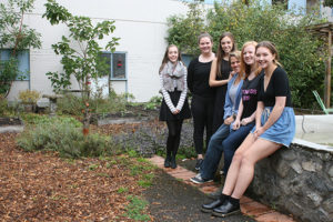 Dan Ebenal/News Staff Reynolds leadership teacher Heather Coey joins Grade 12 students (from left) Emma Andrist, Eilidh Morrison, Kelsey Webb, Michaela Birtwistle and Zephyr Wilson in the school's courtyard. Reynolds was recently named the third greenest school in Canada.